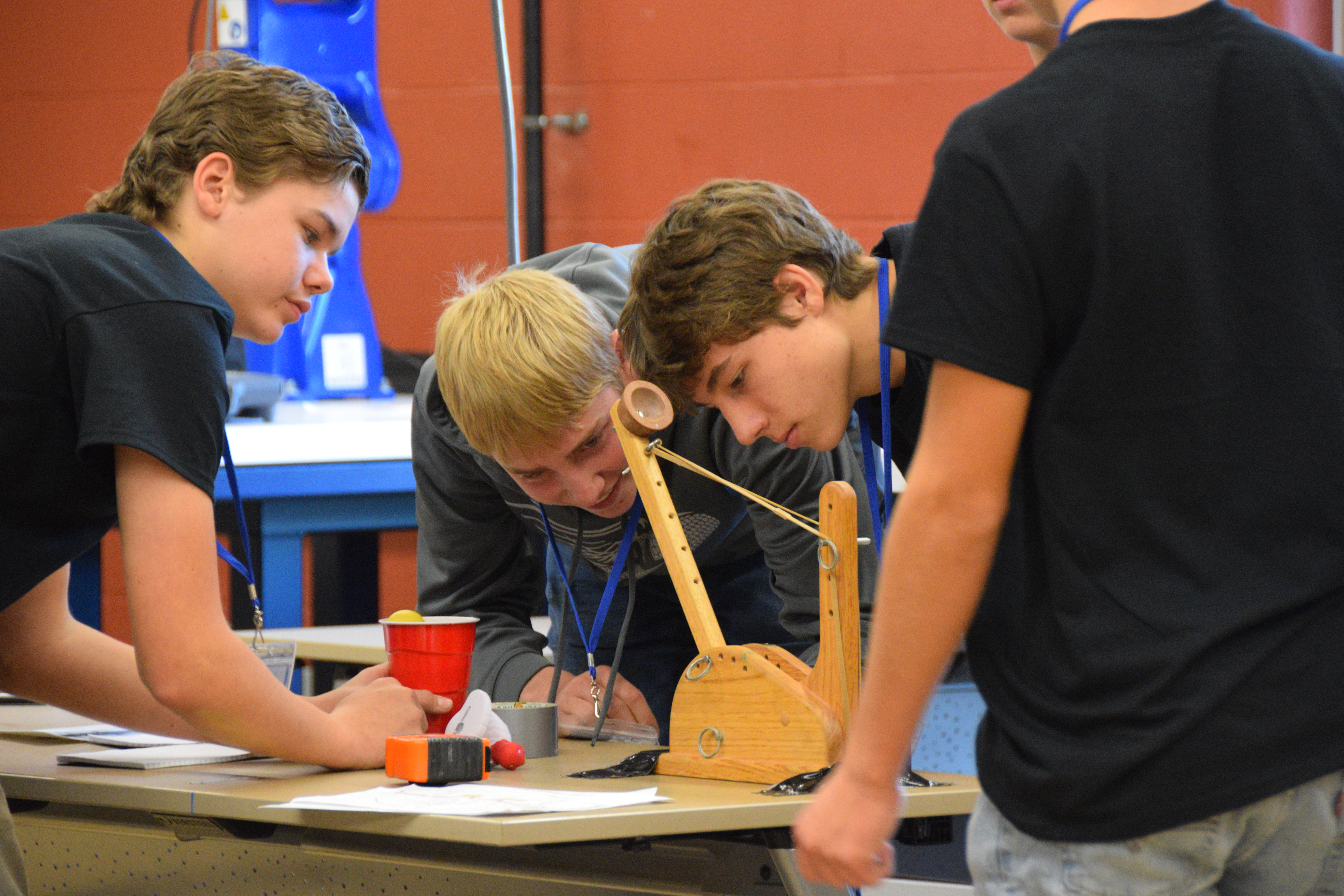 High school male students building a catapult at VU Jasper