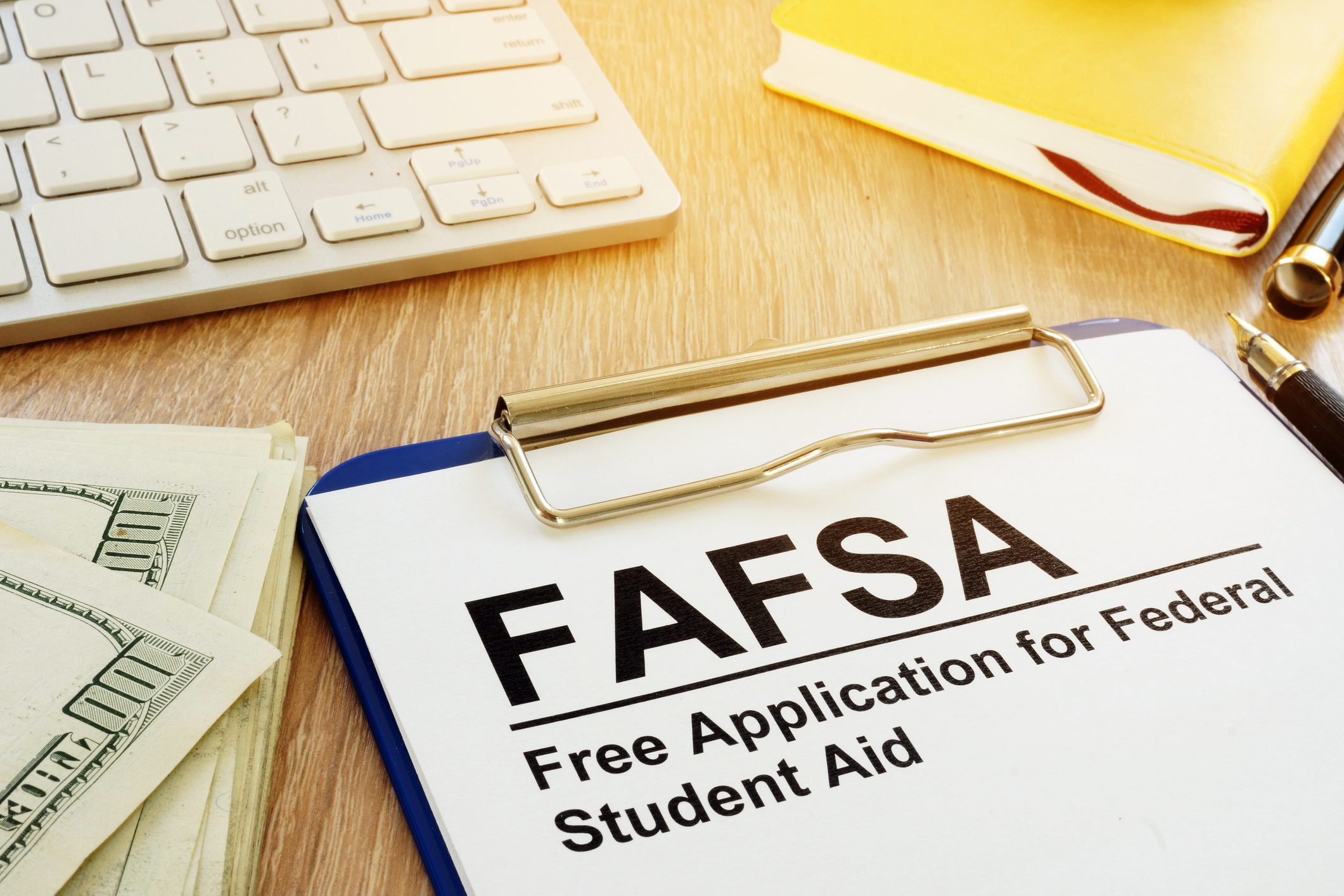 Image of FAFSA form, notebook and computer keyboard 