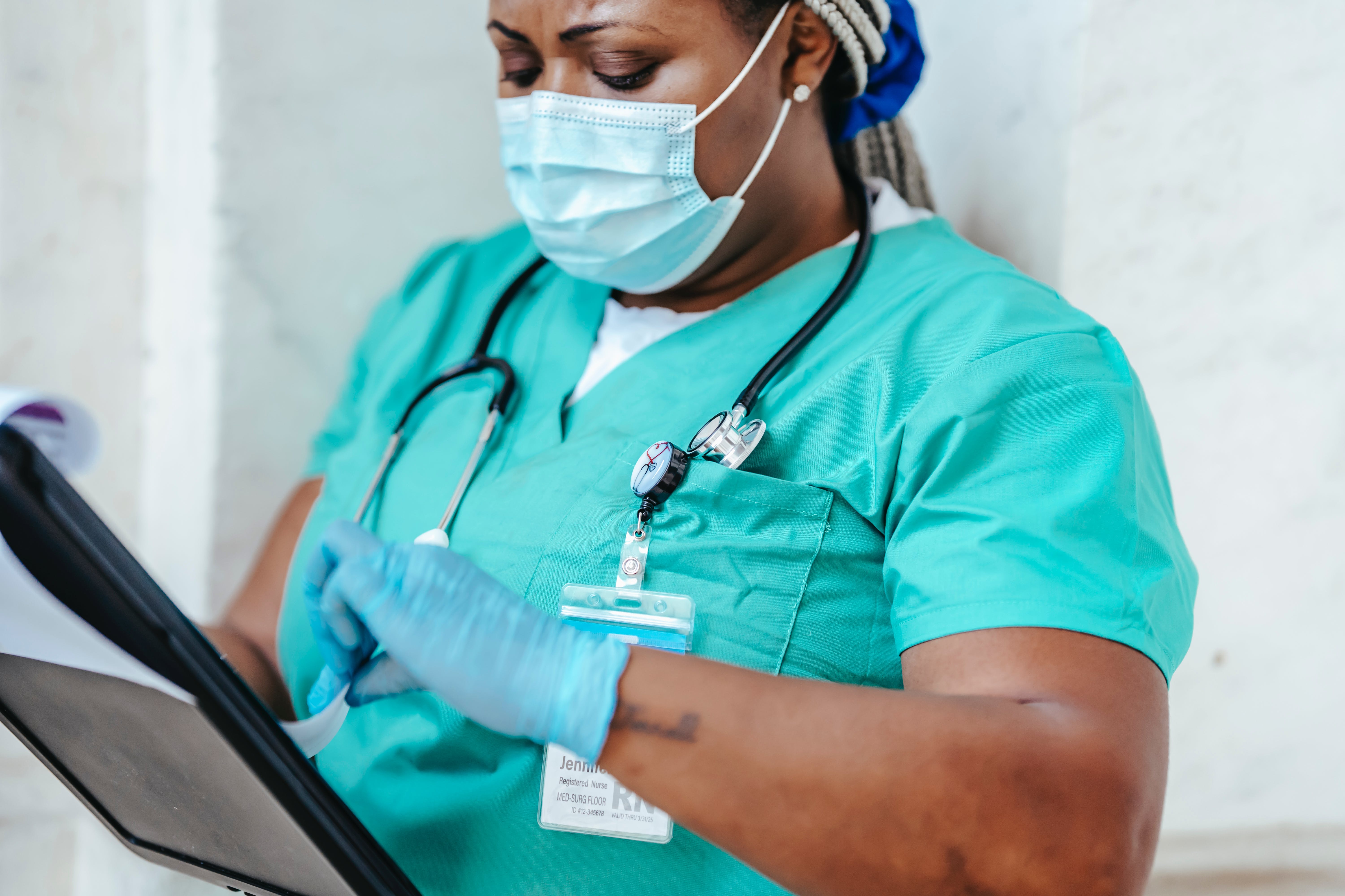African American female nurse wearing PPE