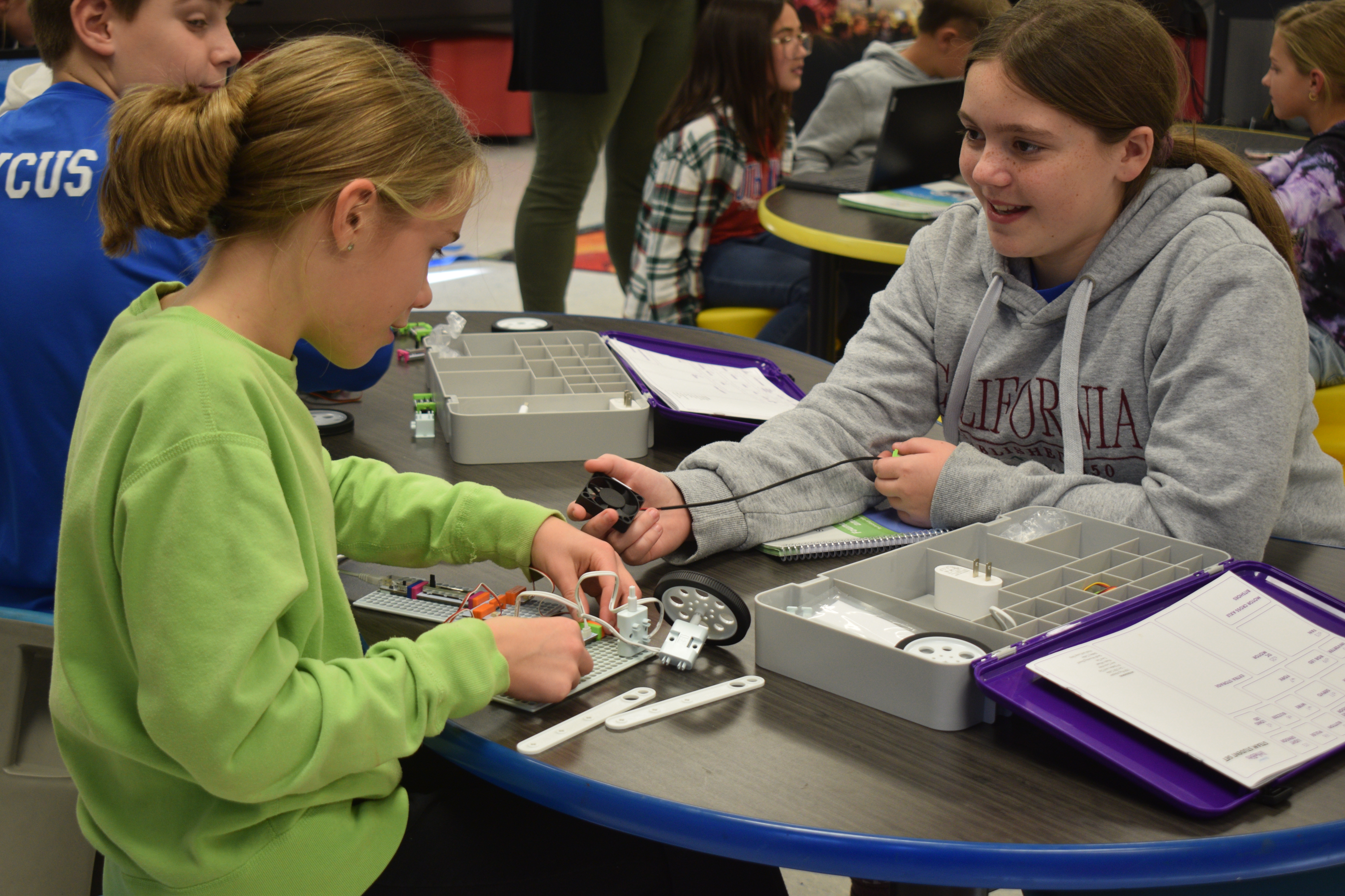 Two female South Knox Elementary School students participating in a hands-on learning project in the school's Design and Innovation Studio. 